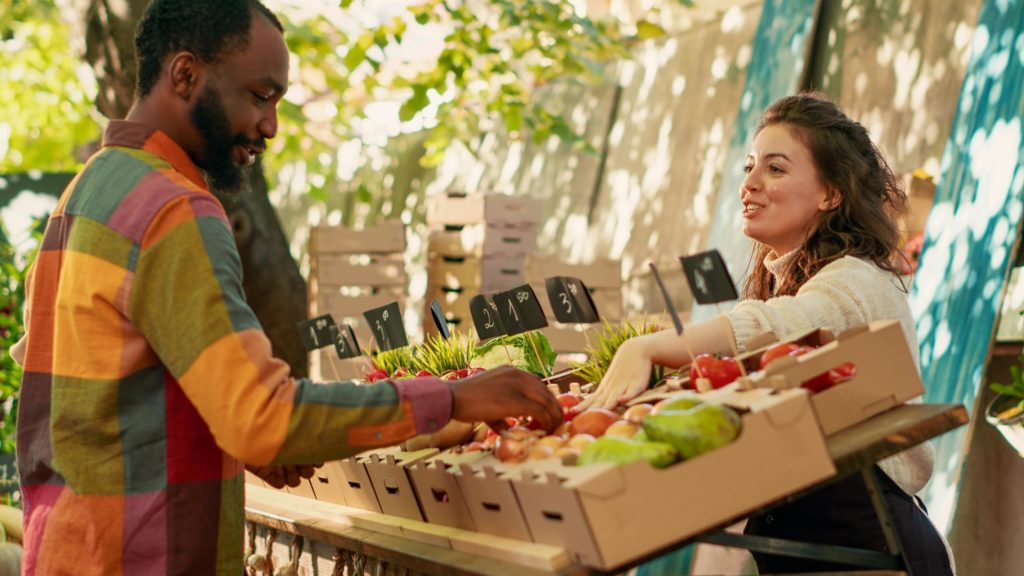 man shopping at farmers market