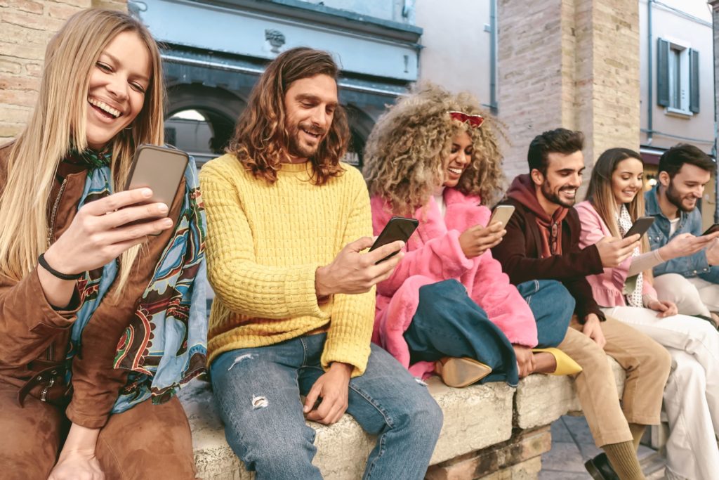 group of friends on their phones