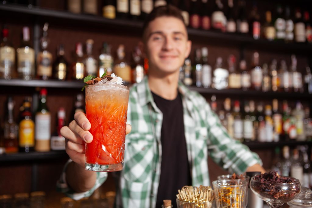 bartender holding drink