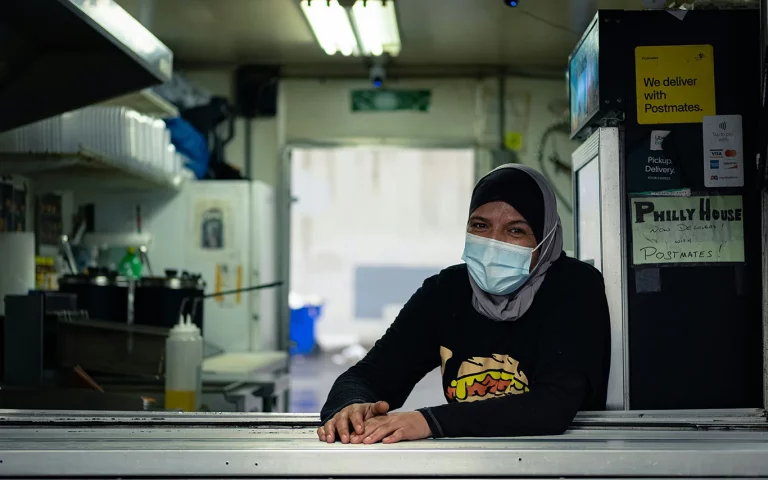 A food truck worker wearing PPE.